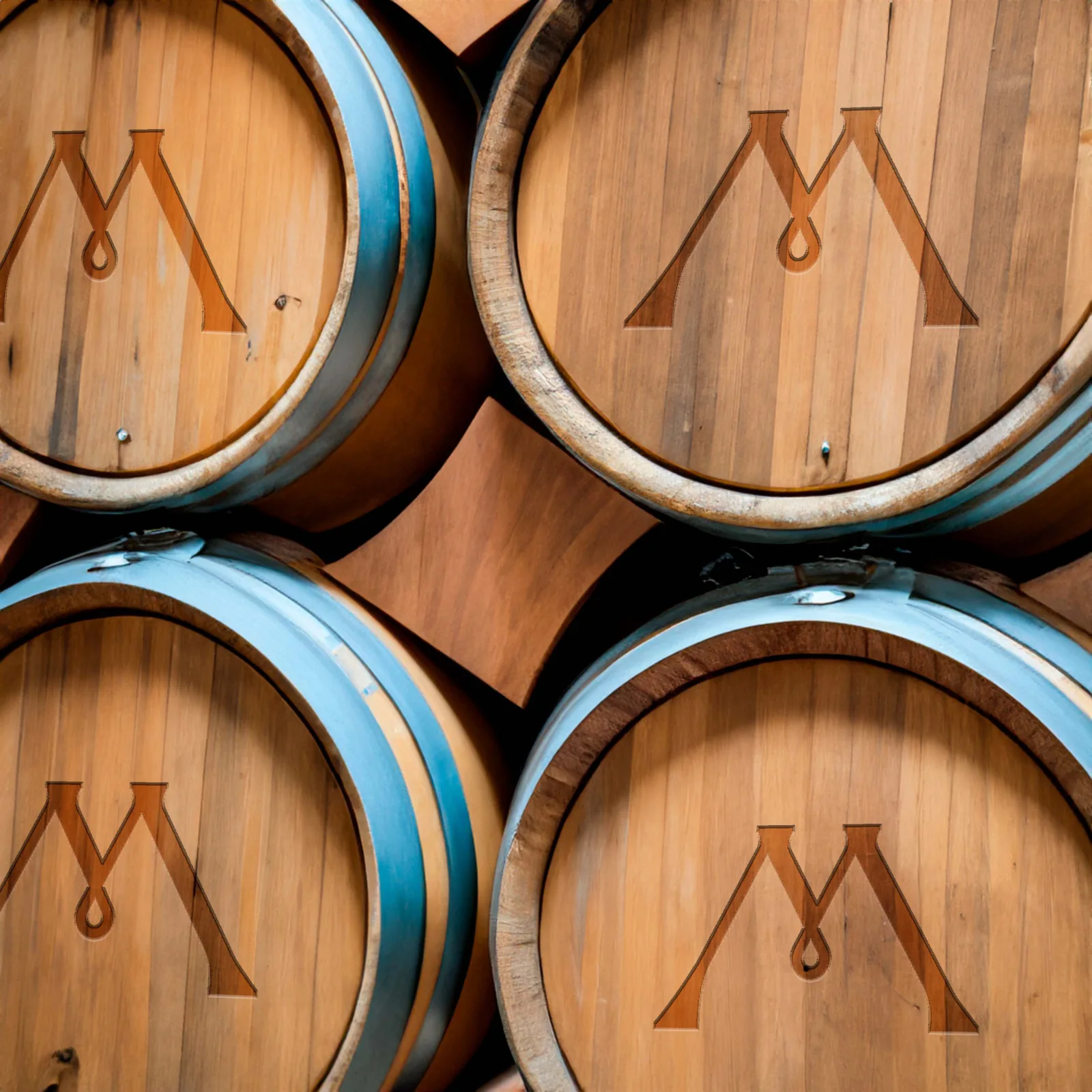 Oak barrels with the Madera monogram burned into the barrel heads